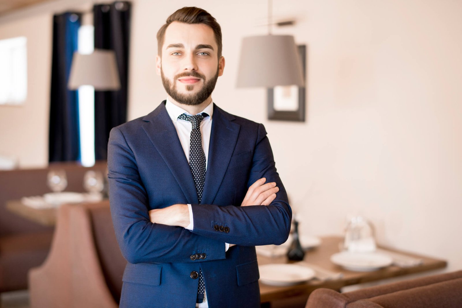 confident-handsome-businessman-in-restaurant-RZHFMVN.jpg